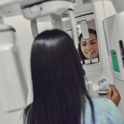 Woman getting cone beam dental scan