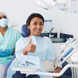 Woman giving thumbs-up for nitrous oxide dental sedation in Laguna Niguel 
