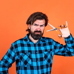 Man holding a pair of scissors