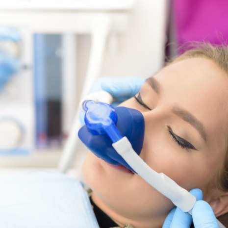 Patient receiving nitrous oxide sedation dentistry treatment